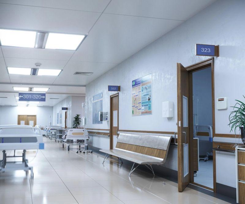 Hospital corridor with patient rooms and seating